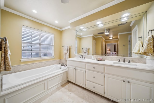 bathroom with crown molding, ceiling fan, vanity, and a bath