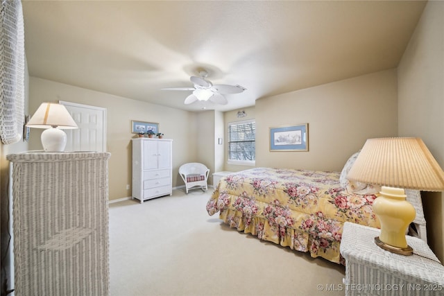 bedroom featuring light colored carpet and ceiling fan