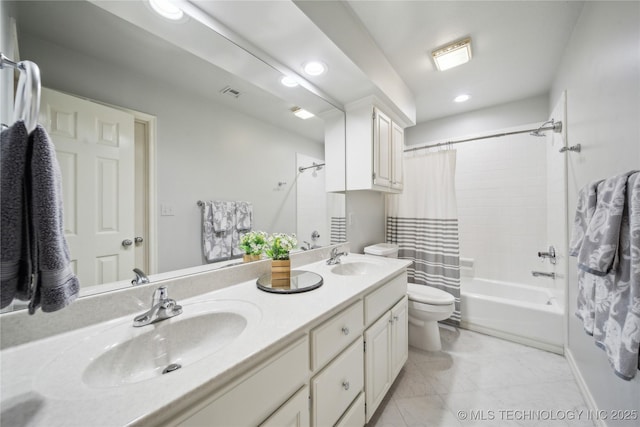 full bathroom featuring tile patterned flooring, vanity, shower / tub combo with curtain, and toilet