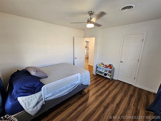 bedroom featuring dark hardwood / wood-style floors and ceiling fan