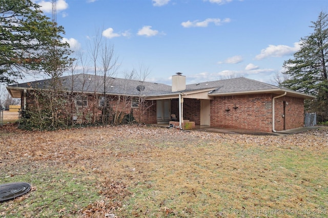 back of house with a yard