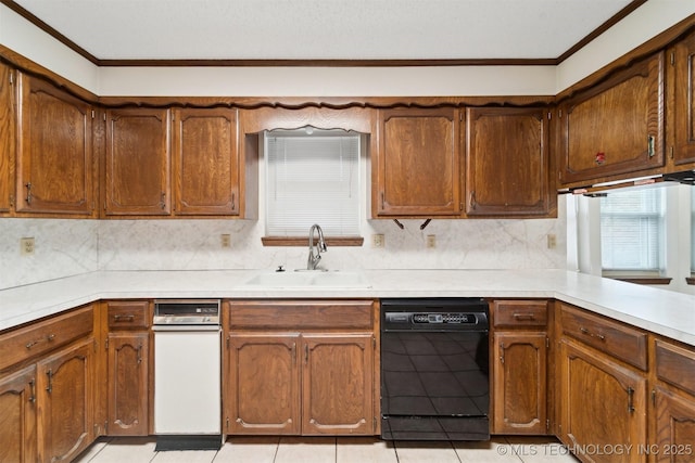 kitchen featuring sink, decorative backsplash, ornamental molding, and black dishwasher