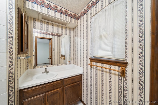 bathroom featuring vanity and a textured ceiling