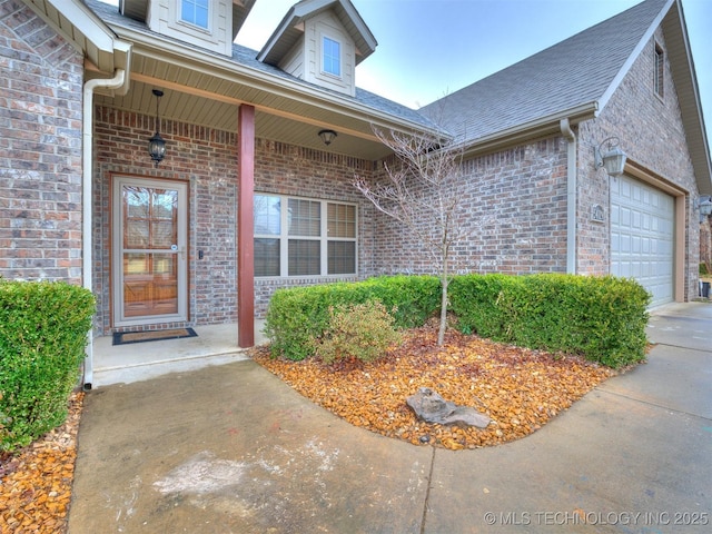 view of exterior entry with a garage