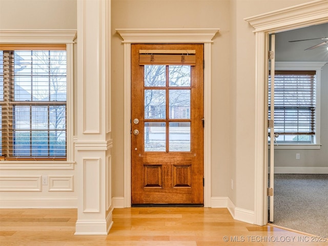 entryway featuring ceiling fan and light hardwood / wood-style floors