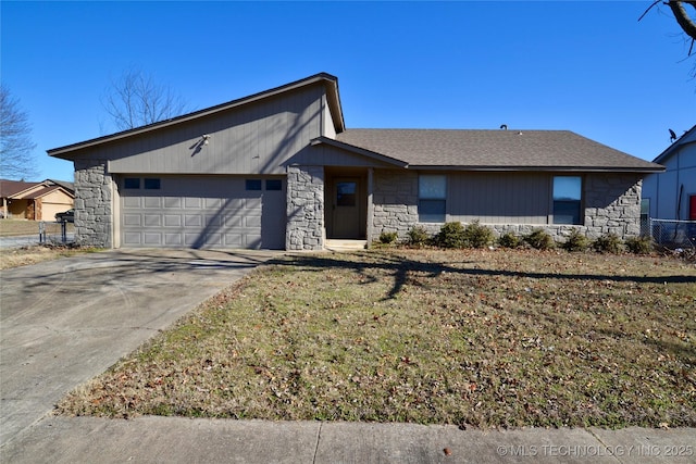 ranch-style house featuring a garage and a front yard