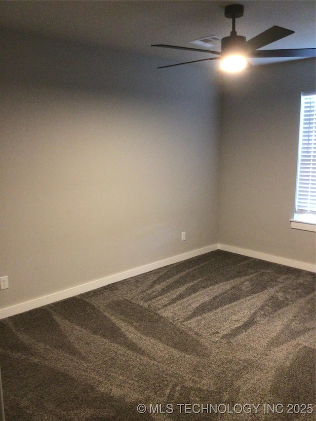 carpeted empty room featuring ceiling fan