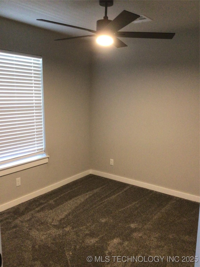 spare room with ceiling fan and carpet flooring