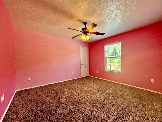 carpeted empty room with a textured ceiling and ceiling fan