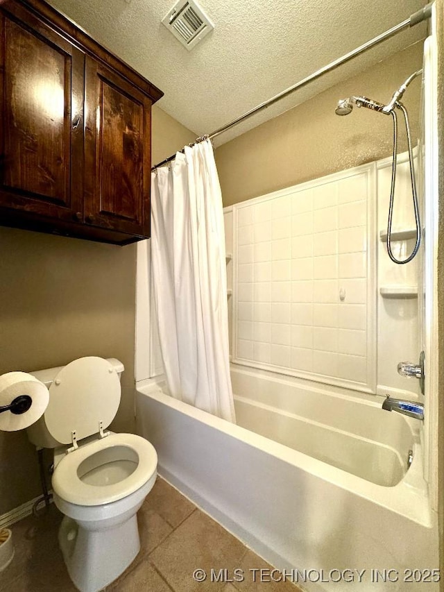 bathroom featuring shower / bath combination with curtain, tile patterned floors, toilet, and a textured ceiling