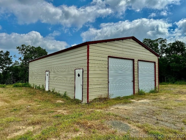 garage with a lawn