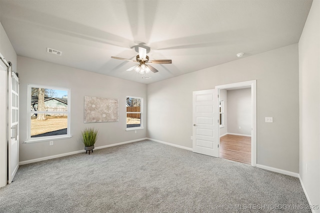 unfurnished bedroom featuring carpet flooring and ceiling fan