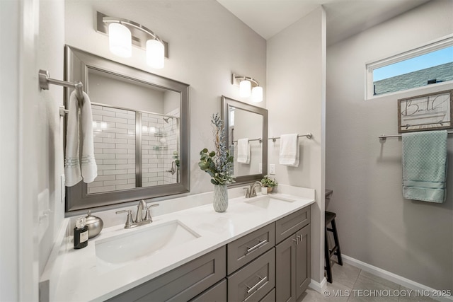 bathroom with vanity, a shower with door, and tile patterned flooring