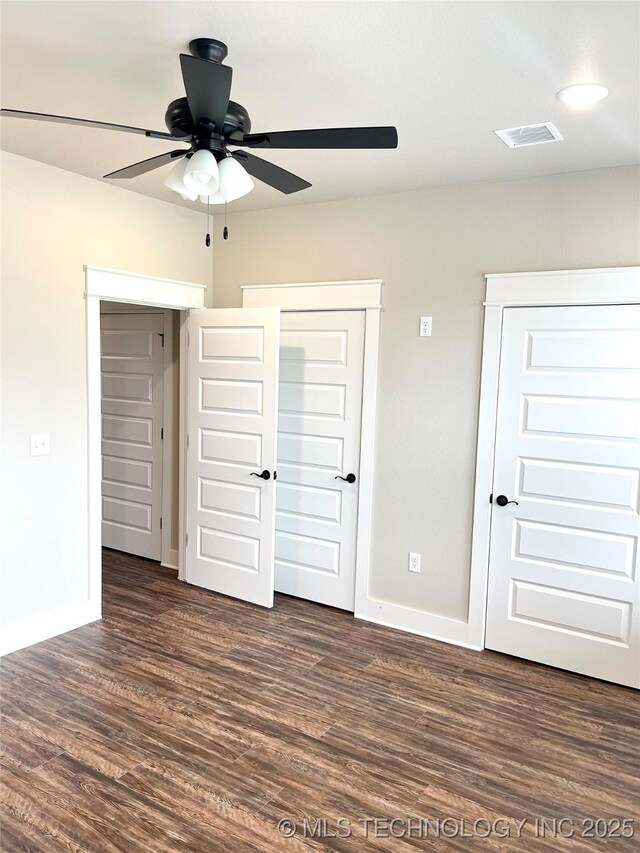 29910 94th Dr W Unit 1 & 2, Afton, OK 74331 - unfurnished bedroom featuring baseboards, dark wood-style floors, and ceiling fan