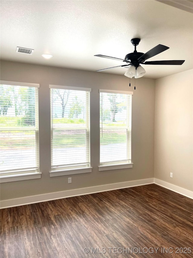 29910 94th Dr W Unit 1 & 2, Afton, OK 74331 - spare room with dark wood-style floors, a ceiling fan, and baseboards