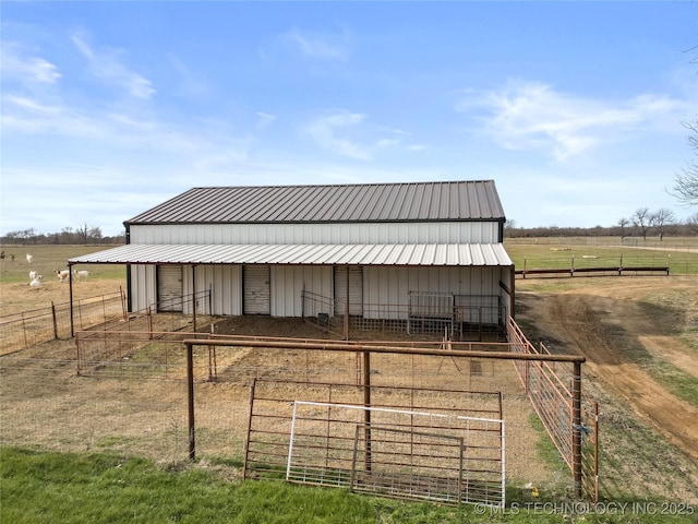 view of outbuilding with a rural view