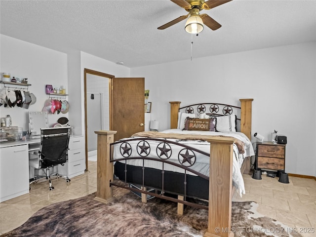 bedroom featuring ceiling fan and a textured ceiling