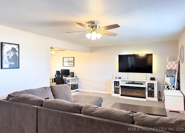 living room with ceiling fan and carpet flooring