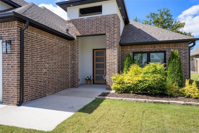 property entrance with a yard