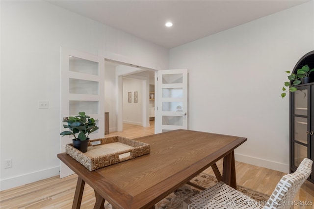 office space with light hardwood / wood-style flooring