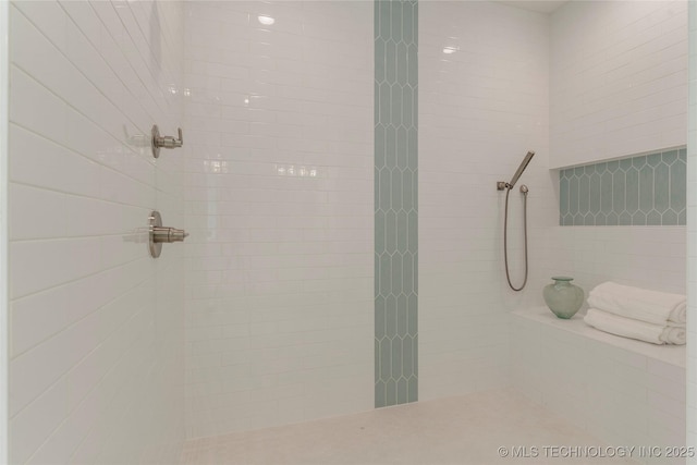 bathroom featuring tiled shower