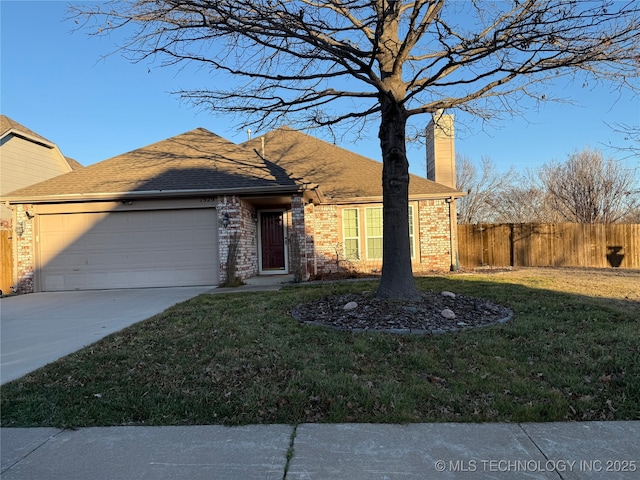 view of front of property with a garage and a front yard