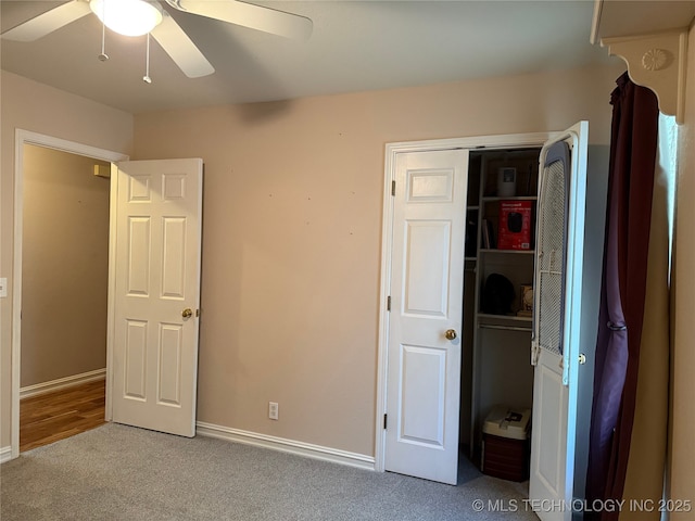 unfurnished bedroom featuring light carpet and ceiling fan