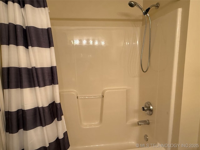 bathroom with shower / bathtub combination with curtain