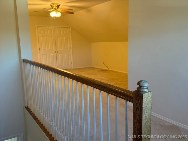 stairs with carpet flooring and vaulted ceiling