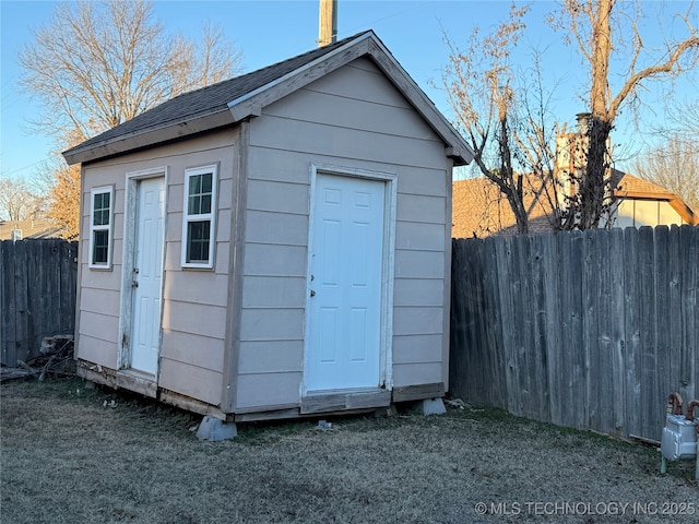 view of outbuilding featuring a yard