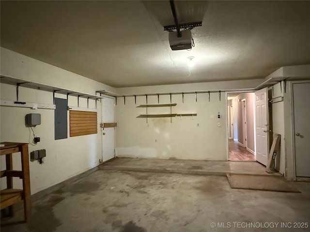 garage featuring a garage door opener and electric panel