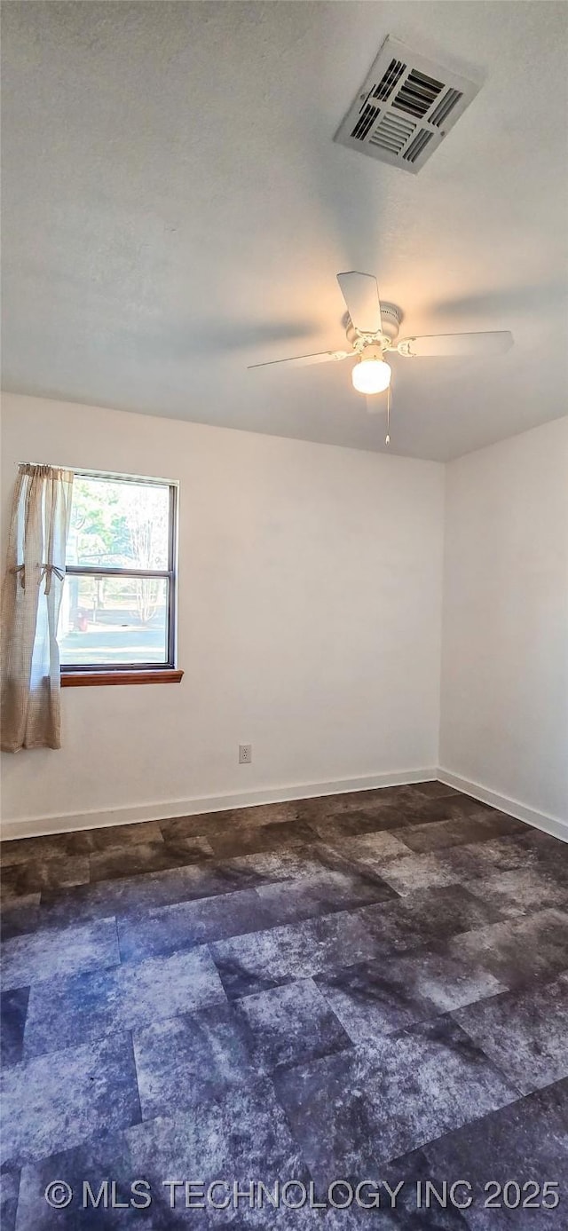 spare room featuring ceiling fan