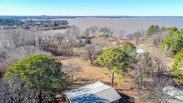 drone / aerial view featuring a water view and a rural view