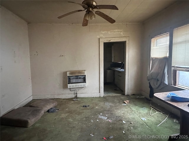 interior space featuring heating unit and ceiling fan