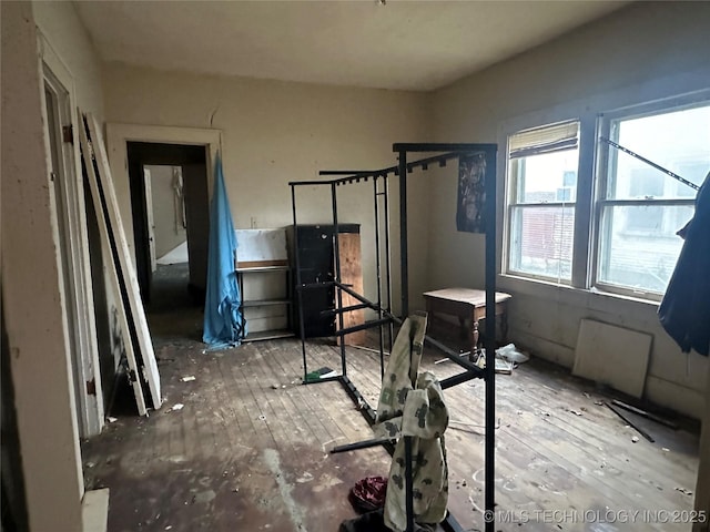 workout area with hardwood / wood-style flooring