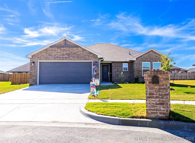 ranch-style house featuring a garage and a front yard