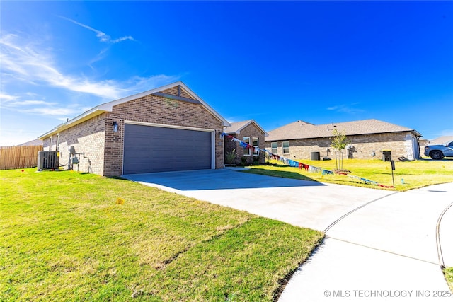 ranch-style house with a garage, central AC, and a front yard