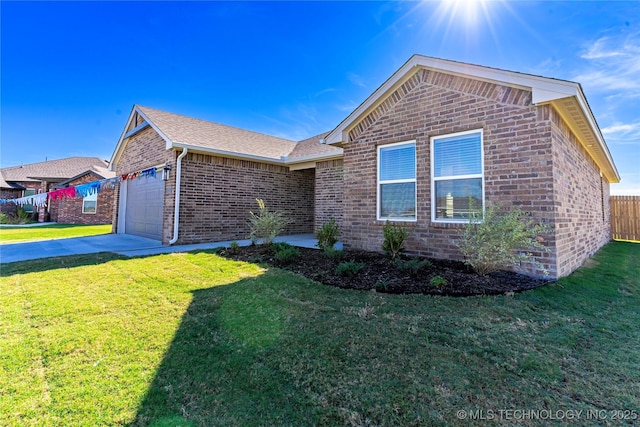 view of front of house with a garage and a front yard