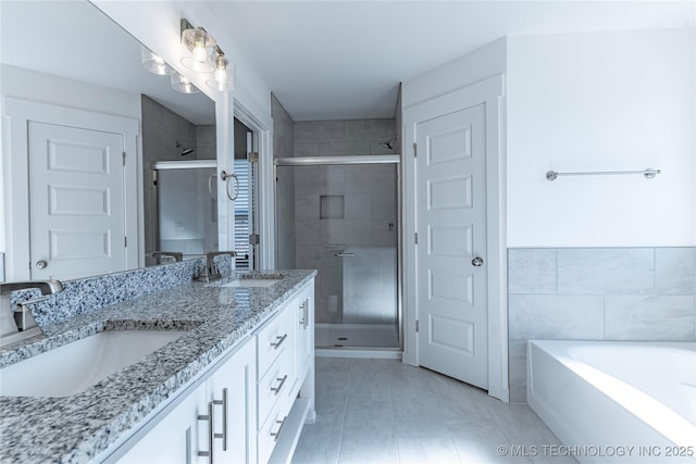 bathroom with vanity, separate shower and tub, and tile patterned flooring