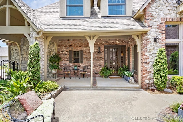 doorway to property featuring covered porch