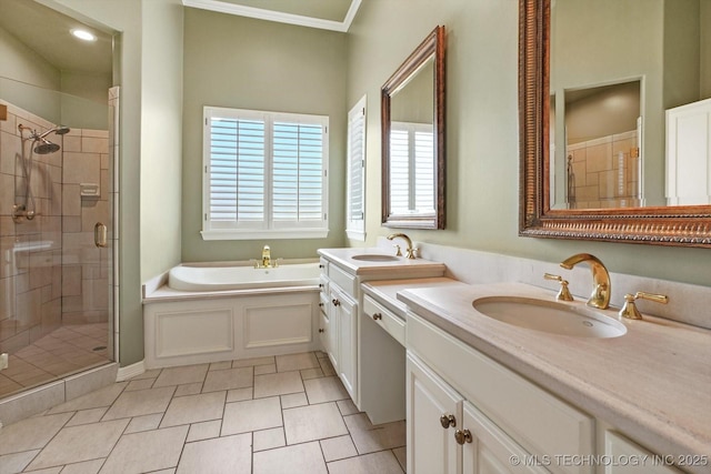 bathroom with vanity, ornamental molding, and separate shower and tub