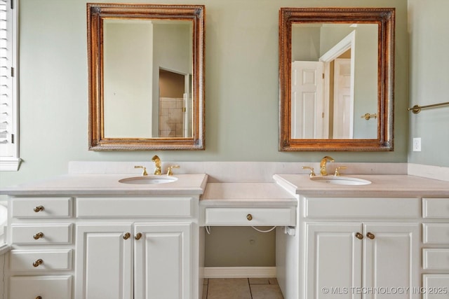 bathroom with vanity and tile patterned flooring