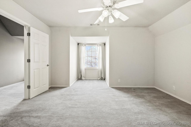 additional living space featuring ceiling fan and light colored carpet