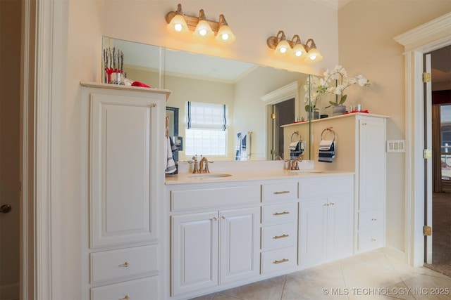 bathroom featuring tile patterned flooring, vanity, and ornamental molding