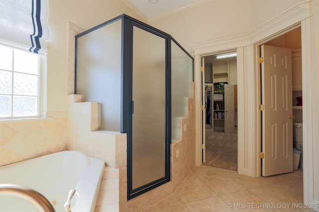 bathroom featuring independent shower and bath, crown molding, and tile patterned flooring