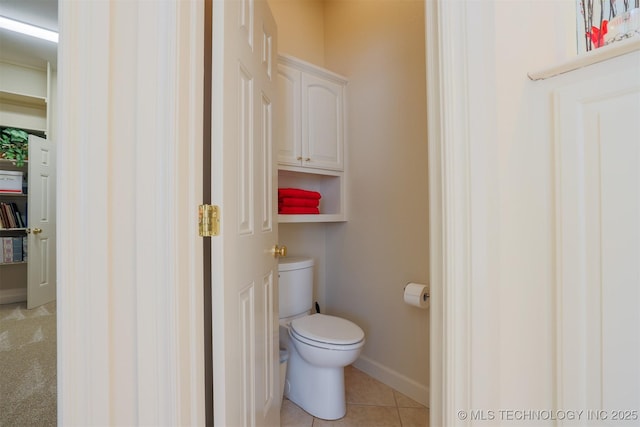 bathroom with tile patterned floors and toilet