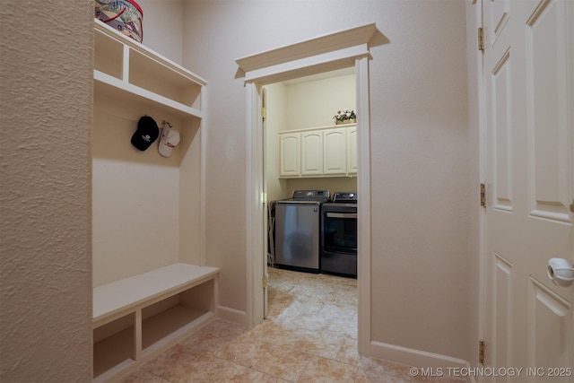 mudroom with separate washer and dryer