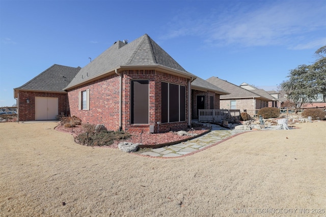 view of side of property featuring a yard