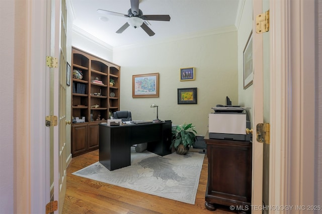 office with ceiling fan, ornamental molding, and light wood-type flooring