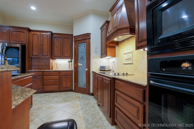 kitchen with premium range hood, ornamental molding, light stone counters, and black appliances